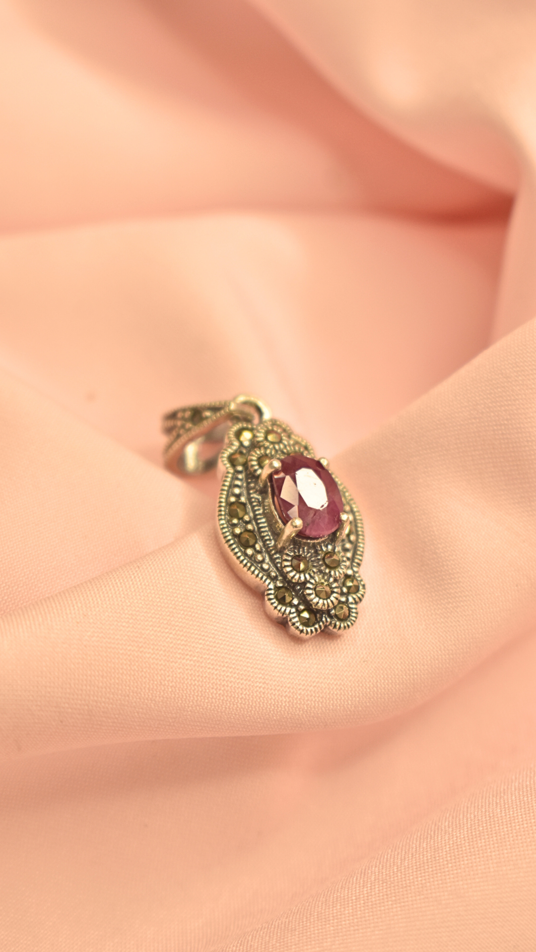 Elegant Silver Pendant with Purple Stone and Filigree Detailing
