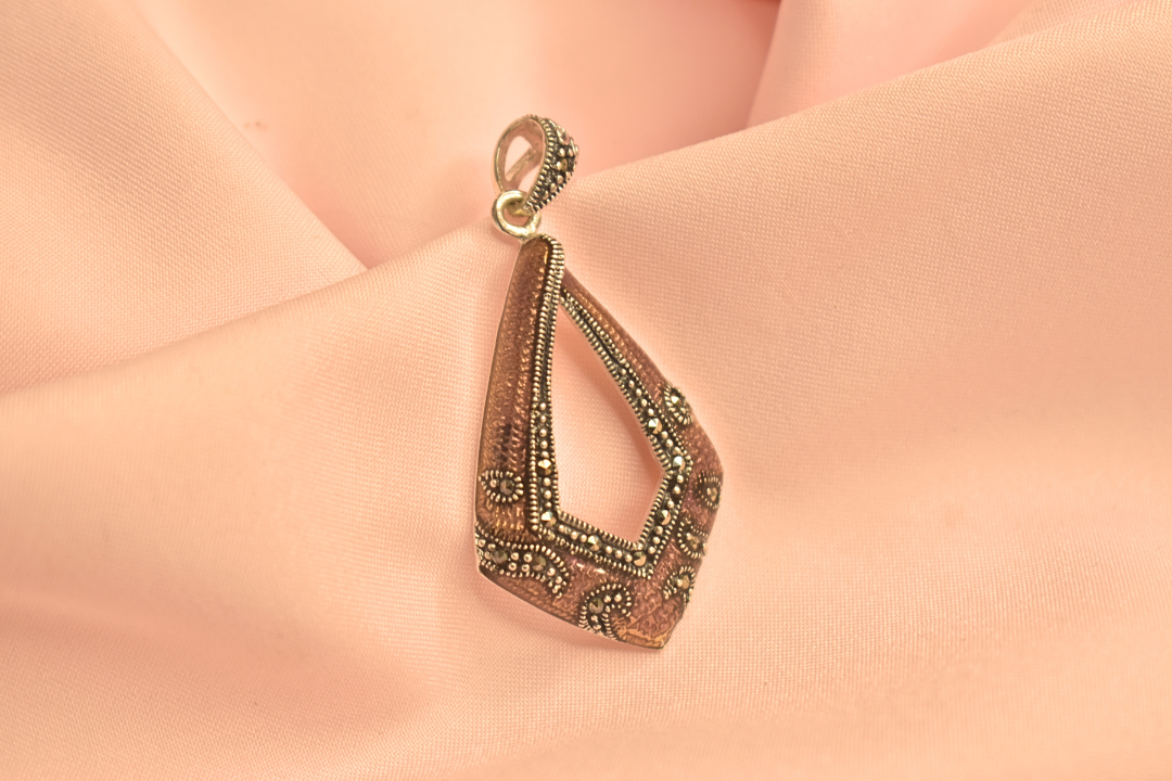 Vintage-Inspired Silver Pendant with Intricate Detailing