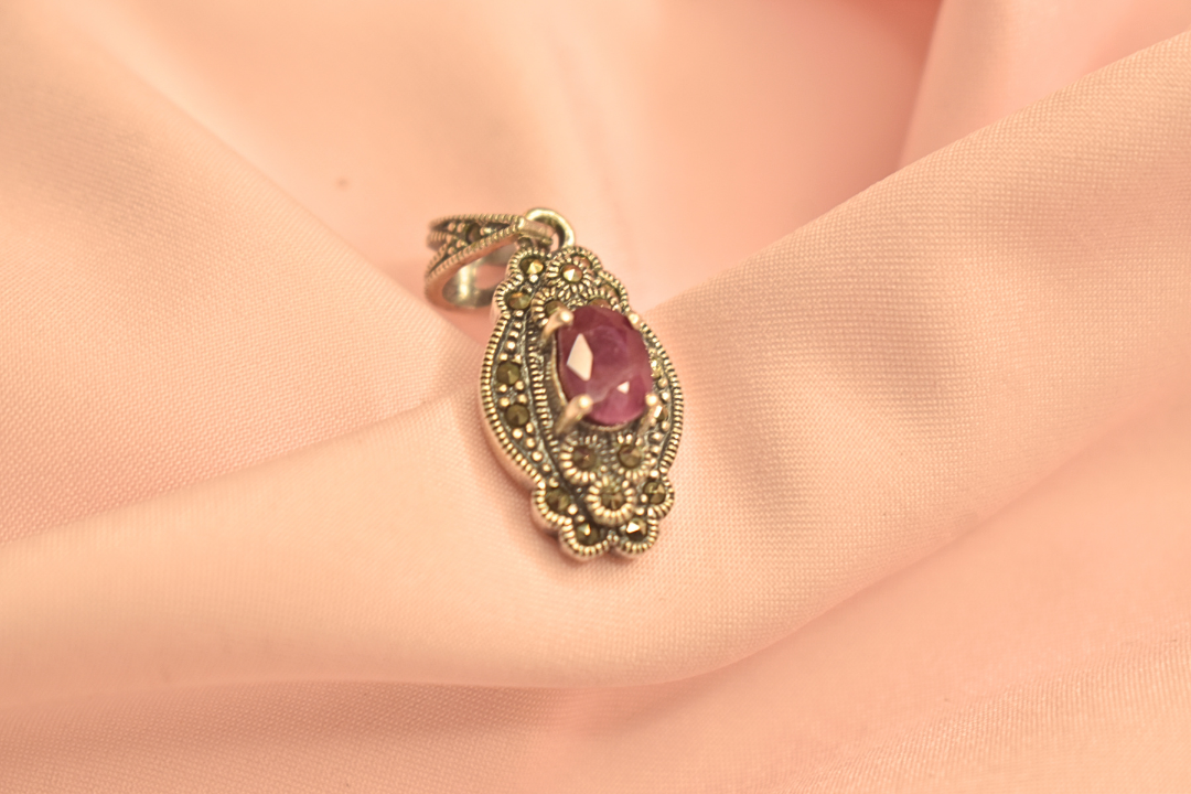 Elegant Silver Pendant with Purple Stone and Filigree Detailing