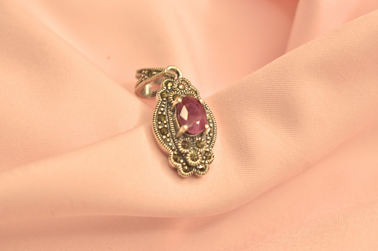 Elegant Silver Pendant with Purple Stone and Filigree Detailing