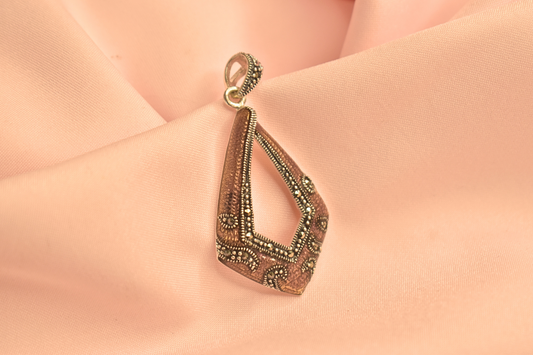 Vintage-Inspired Silver Pendant with Intricate Detailing